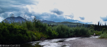 A fisherman works a small stream in Alaska's Bristol Bay region