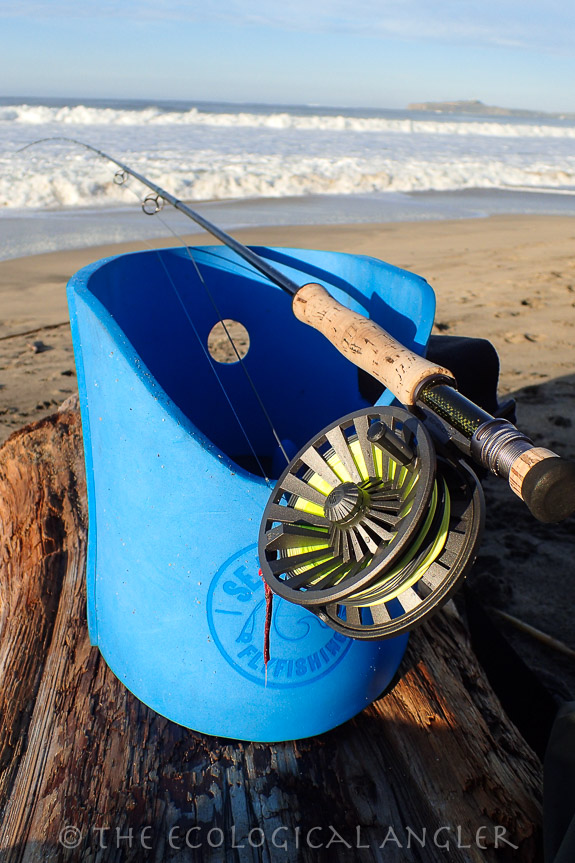 Fly fishing the California surf with a stripping basket helps you catch bass and perch.