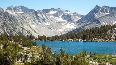 Fly Fishing in the High Sierra Nevada with Pioneer Lake in the foreground.