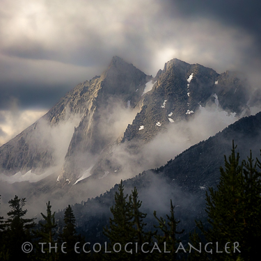 Sierra Nevada Mountain peaks glow after thunder shower in the John Muir Wilderness
