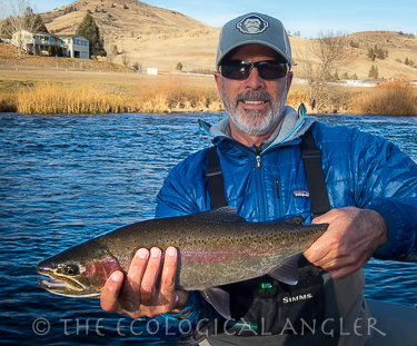 Michael Carl with a steelhead caught on fly fishing the Klamath River in California.