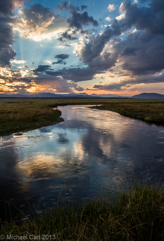 The sun sets over the Sierra Nevada Mountains and fishing the Upper Owens River is a great place to watch it.
