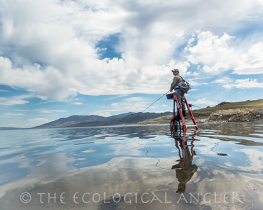 Glassy reflection of clouds makes for a great photograph but fishing for Pyramid Lake Lahontan cutthroat is not ideal.