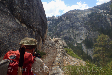 Backpacking along the trail over Muir Gorge inside the Grand Canyon of the Tuolumne in Yosemite National Park